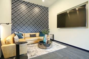 a living room with a couch and a television